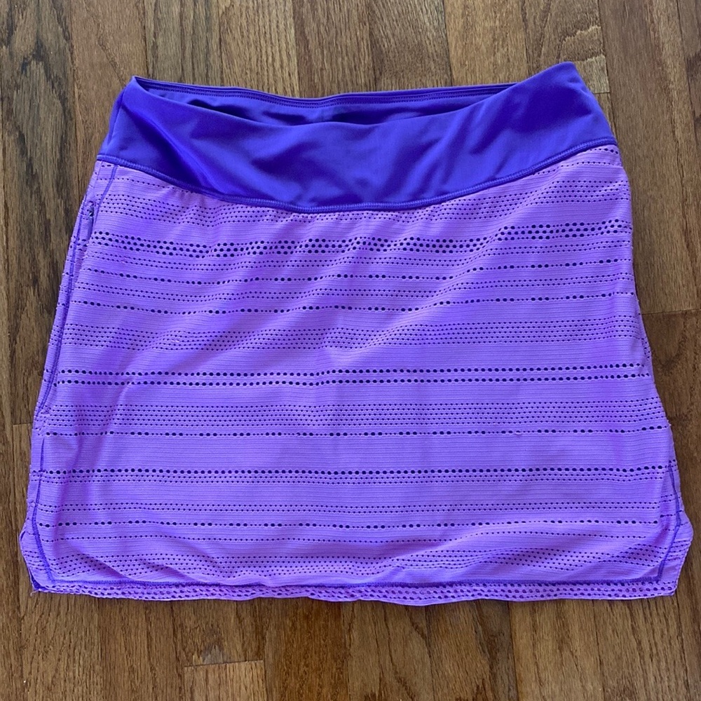 Under Armour Golf Skort size SM loose. Pink/Purple